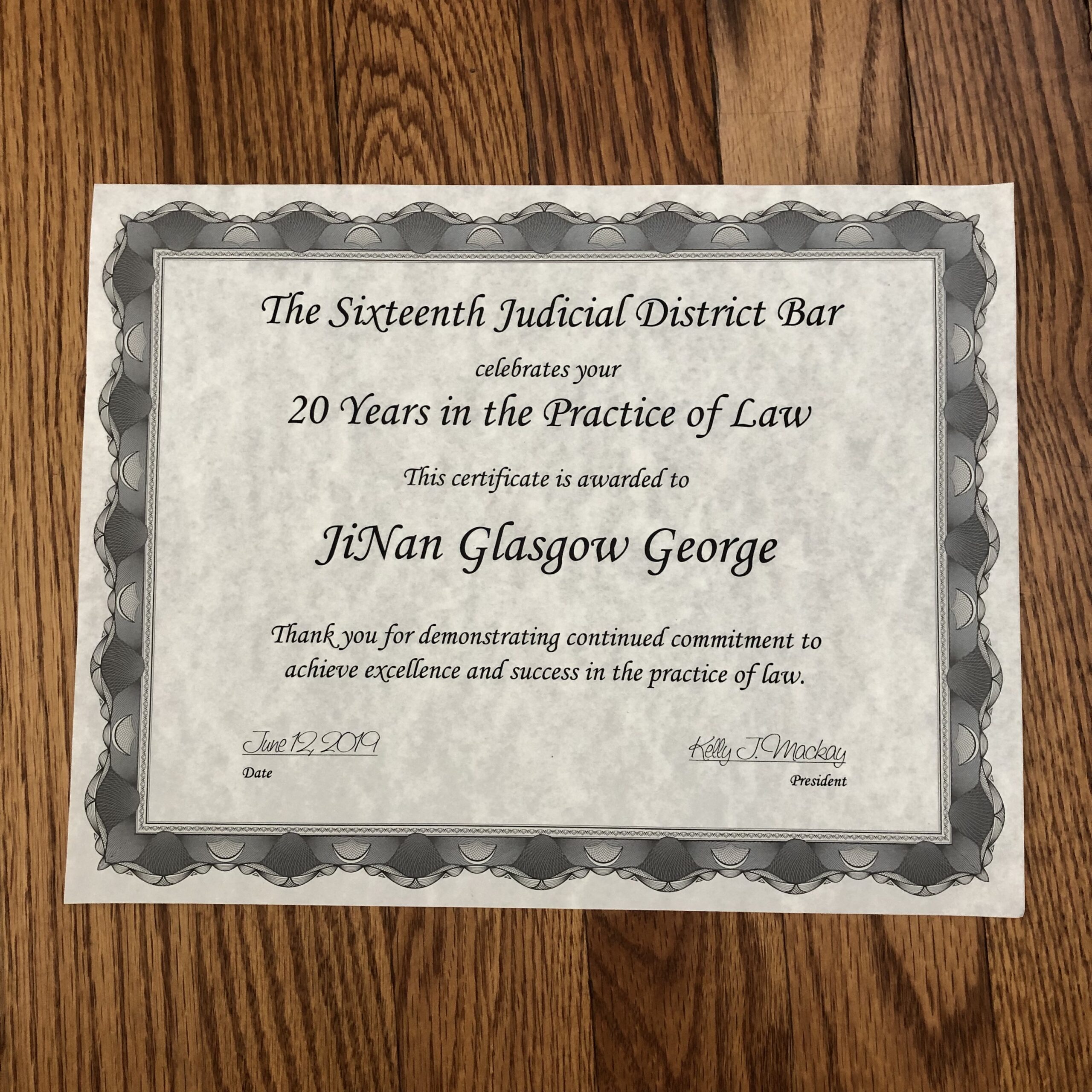 JiNan Glasgow George recognized for 20 years of practicing law by the Durham Bar
